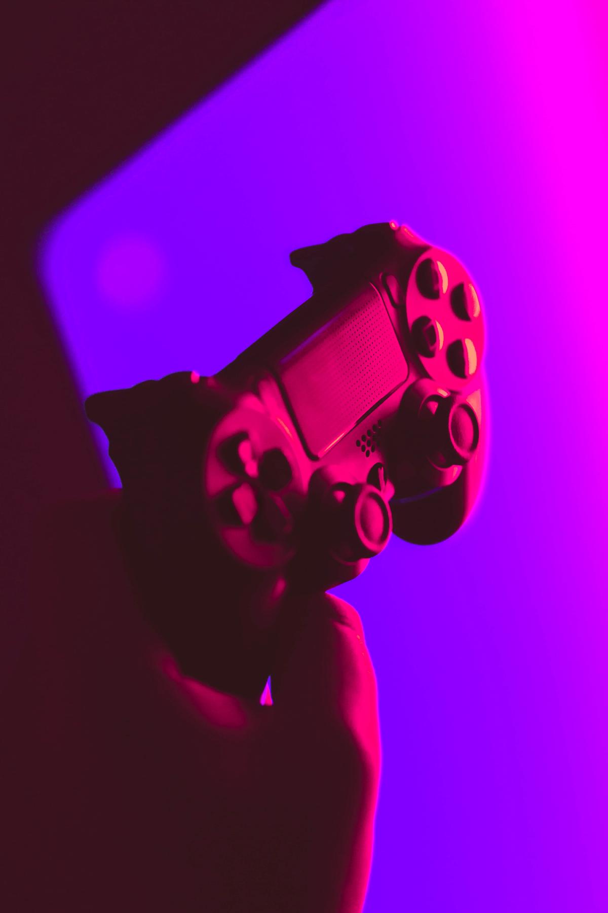 A person holding a force feedback controller, fully immersed in a video game